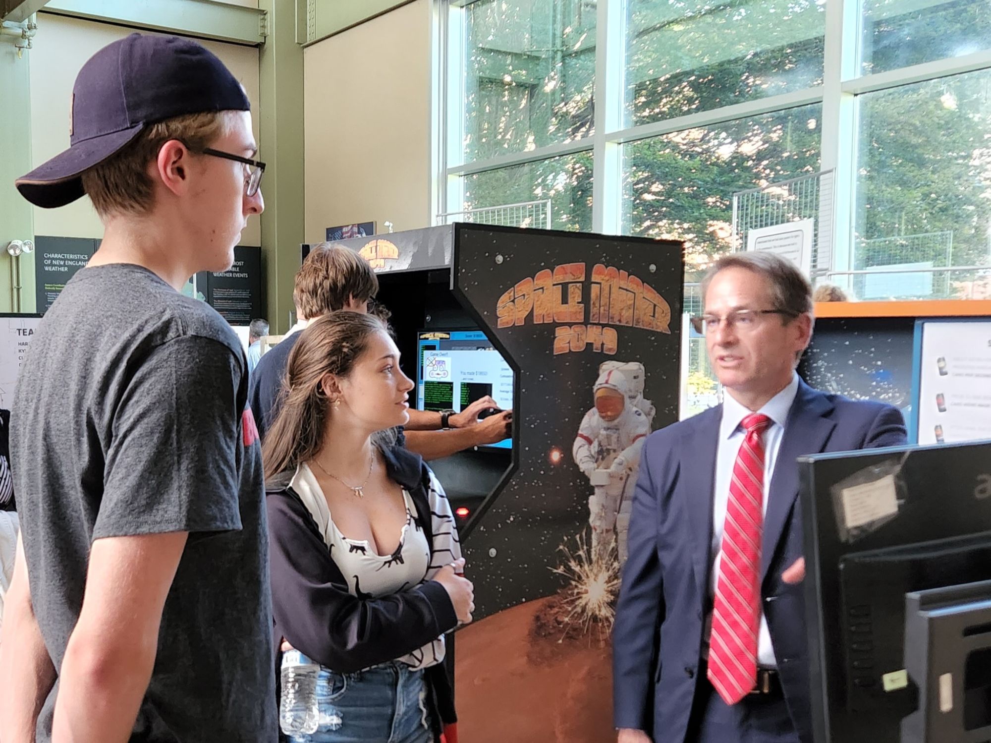 NH Department of Education Commissioner Frank Edelblut talks to SST students Christian Hanson and Olivia Wheeler