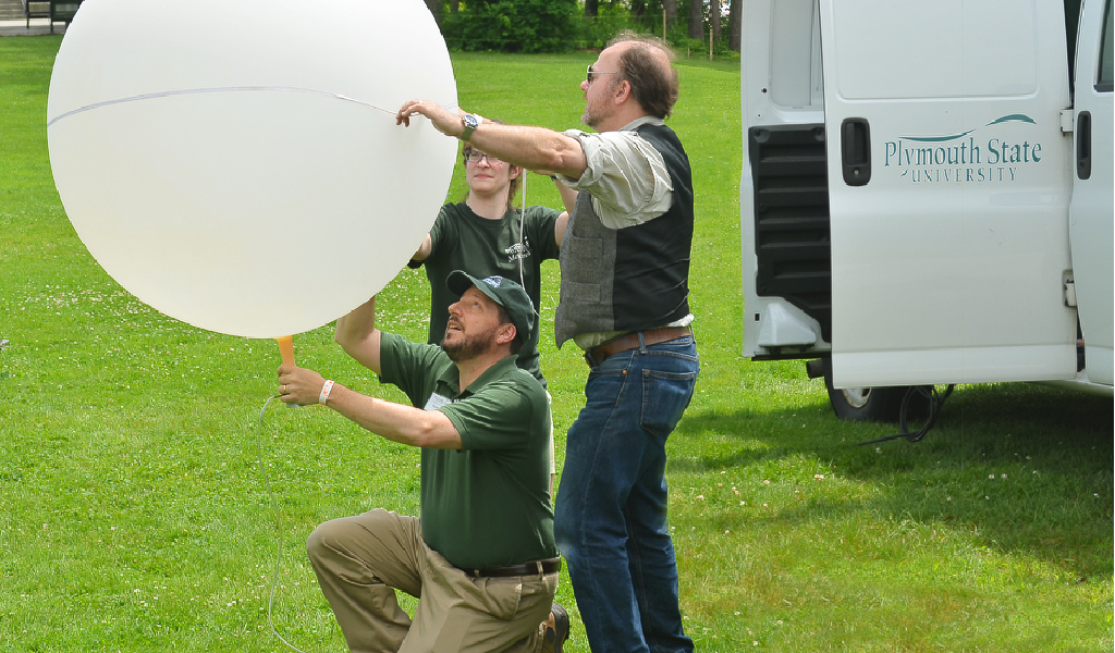 PSU professor Eric Hoffman assists in a weather balloon launch