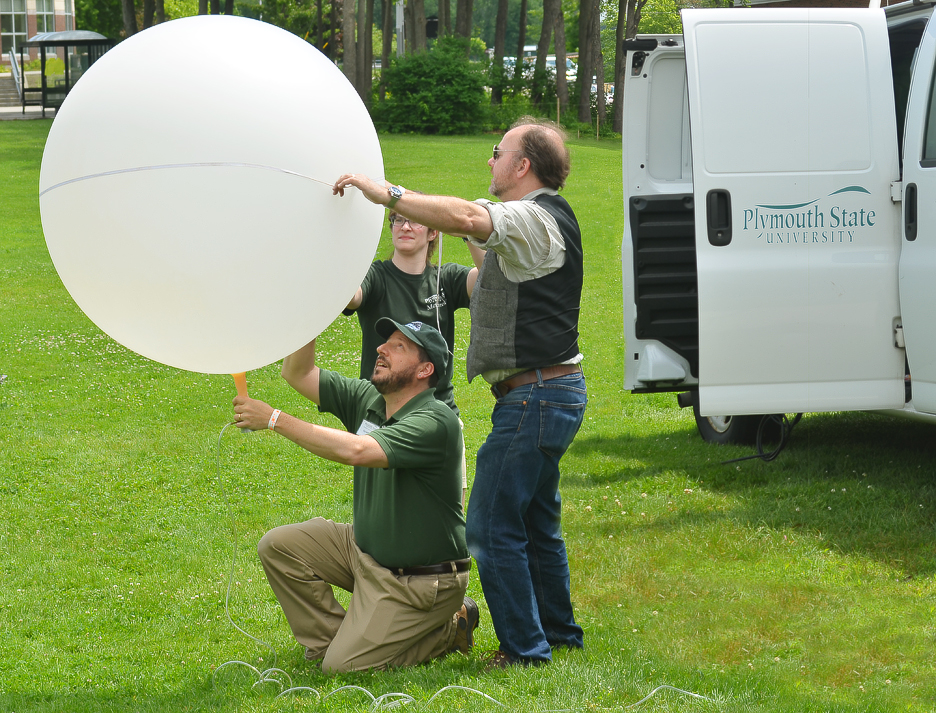 Plymouth State University faculty and volunteers prepare to launch a weather balloon at AerospaceFest in 2013