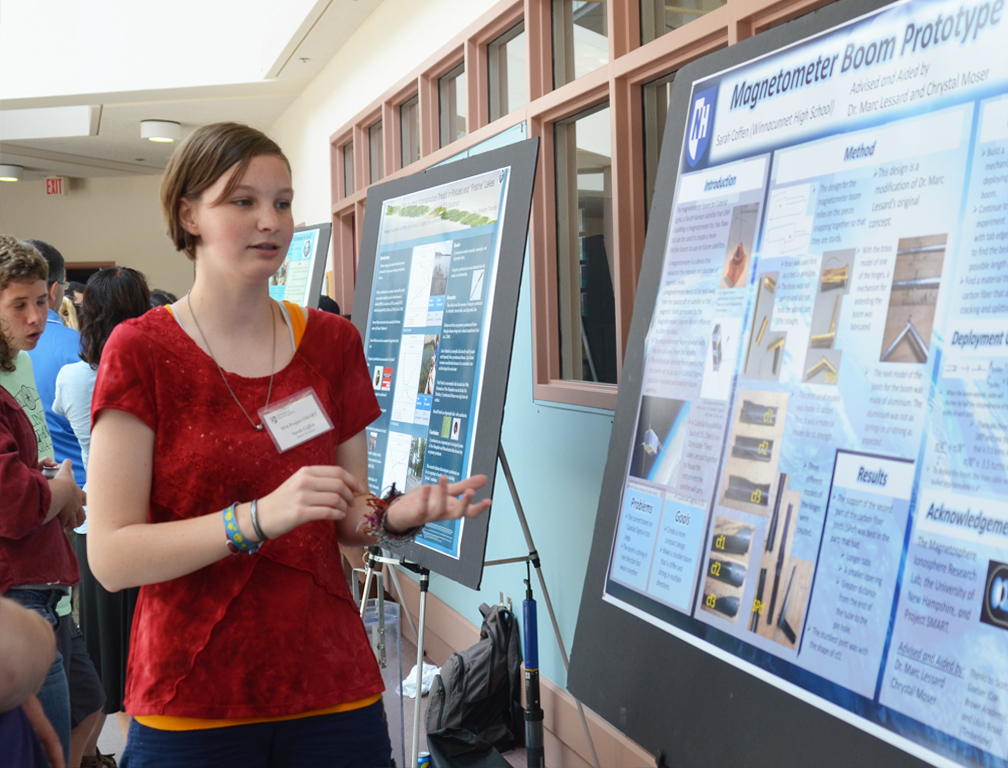Project SMART student explains her research at the closing poster session